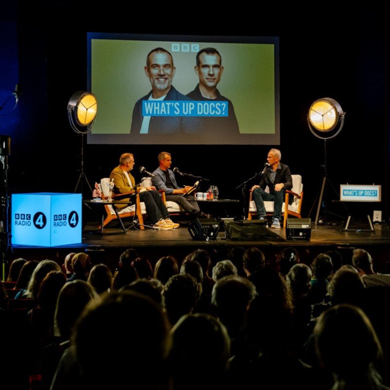 Drs Chris and Xand van Tulleken recording the Loftus Media / BBC Radio 4 podcast What's Up Docs? live at Crossed Wires Festival 2026 Photo by photographer Lindsay Melbourne